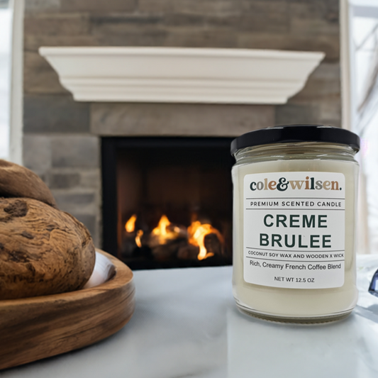 a jar of creme brulee next to a fireplace